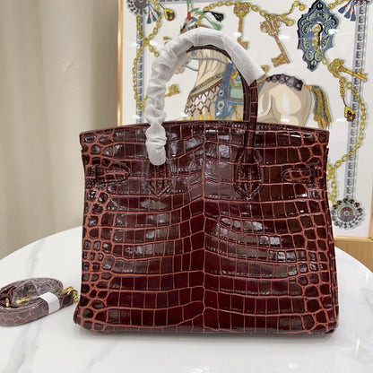 Glossy Bordeaux Red Textured Scaled Structured Top Handle Tote With Radiant Golden Twist Hardware, Matching Lock Tassel And Separate Shoulder Strap