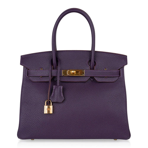 Deep Raisin Purple Medium Structured Top Handle Tote With Full Pebbled Grain Surface, Polished Golden Twist Hardware And Matching Lock Tassel Pendant Set