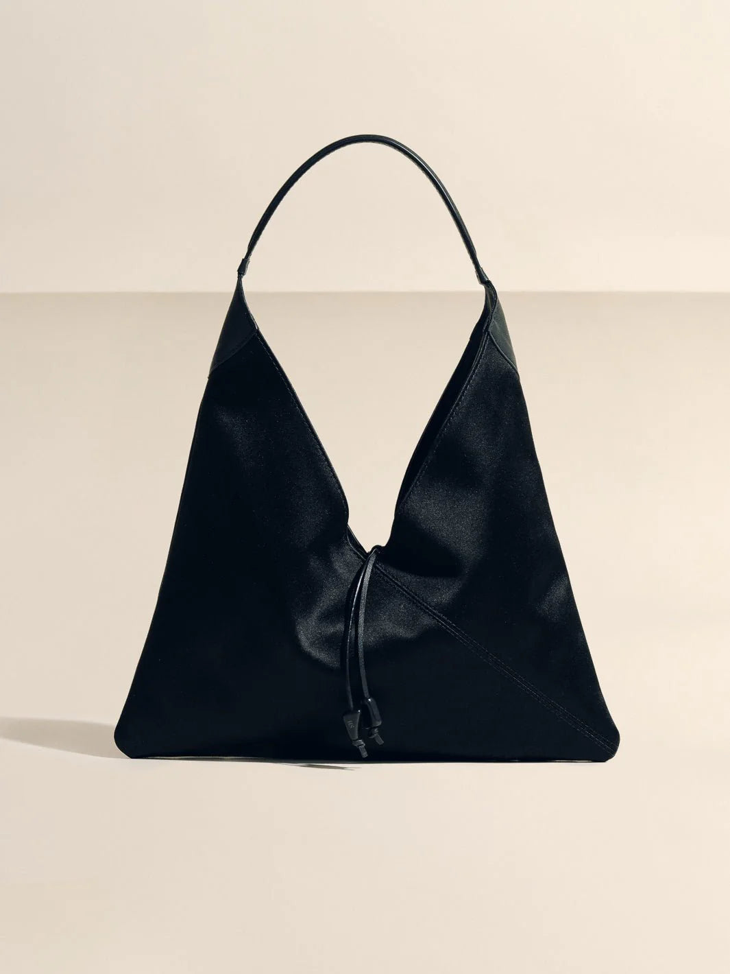 Solid Black Origami Slouchy Bag with Curved Top Handle & Tassel Charm for Evening Daily Outfits
