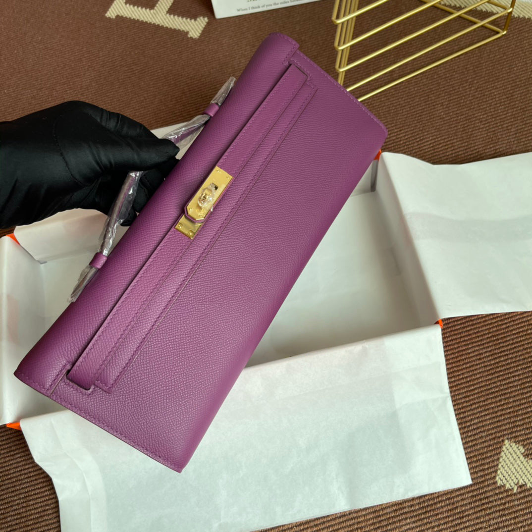 Vibrant Anemone Purple Slim Elongated Evening Clutch With Fine Pebbled Grain Surface And Polished Golden Twist Lock Hardware