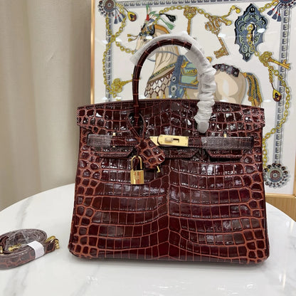 Glossy Bordeaux Red Textured Scaled Structured Top Handle Tote With Radiant Golden Twist Hardware, Matching Lock Tassel And Separate Shoulder Strap