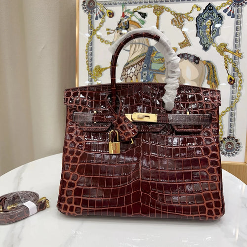 Glossy Bordeaux Red Textured Scaled Structured Top Handle Tote With Radiant Golden Twist Hardware, Matching Lock Tassel And Separate Shoulder Strap